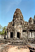 Angkor Thom - Bayon temple, second enclosure, tower of S-E corner from East 